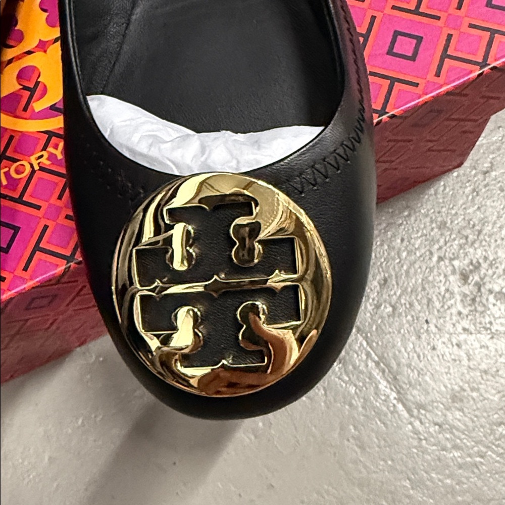 Tory Burch Black Flats with Gold Emblem - Picture 2 of 8